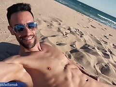 Sexy latin man naked on public beach