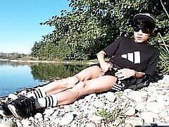 Jon Arteen wanks outdoor on a pebbles beach, the sexy twink wearing short shorts cums on his thigh, and cumplay