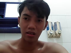 cute skinny asian guy taking a shower