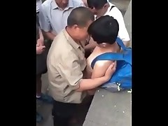 Chinese boy play with older men outdoor